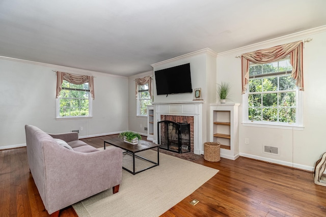 751 Lancaster Rd, Augusta, GA 30909 - living room with wood finished floors, baseboards, a fireplace, and crown molding