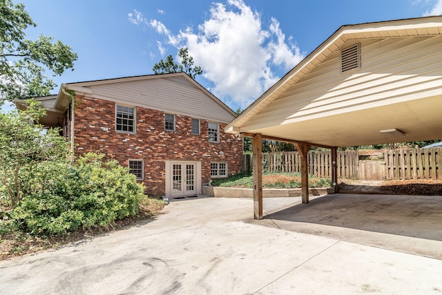 751 Lancaster Rd, Augusta, GA 30909 - view of patio / terrace featuring french doors, a carport, and driveway