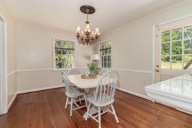 751 Lancaster Rd, Augusta, GA 30909 - dining room featuring a chandelier, crown molding, baseboards, and wood finished floors