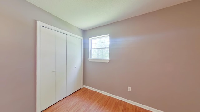 3611 Sturnidae Dr, Augusta, GA 30906 - unfurnished bedroom with a closet and light wood-style flooring