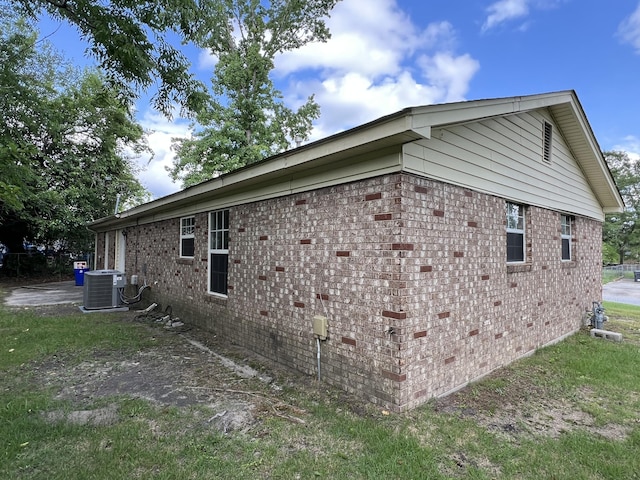 3611 Sturnidae Dr, Augusta, GA 30906 - view of side of home with a central AC unit and brick siding