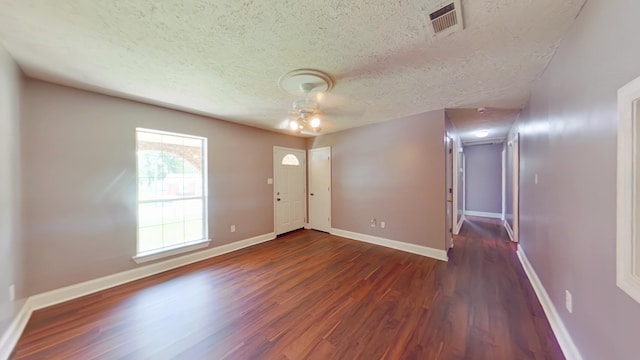 3611 Sturnidae Dr, Augusta, GA 30906 - entrance foyer with dark wood-style flooring, a textured ceiling, and ceiling fan