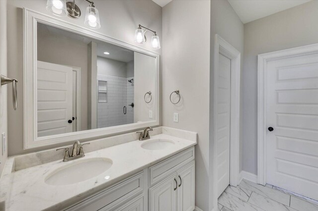 bathroom with vanity and a shower with shower door