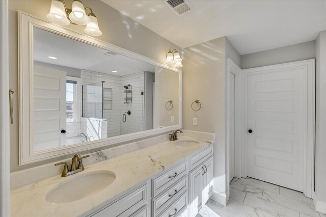 bathroom featuring vanity and an enclosed shower