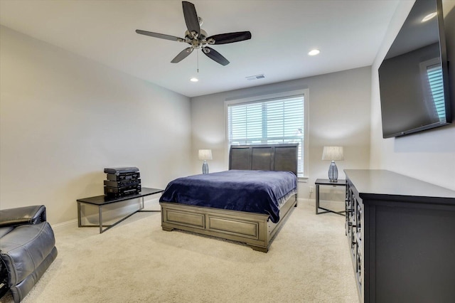 carpeted bedroom with ceiling fan