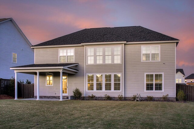 view of front of home with a lawn