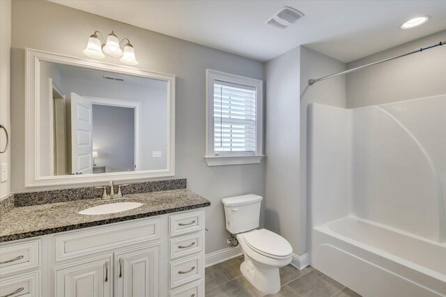 full bathroom with tile patterned floors, vanity,  shower combination, and toilet