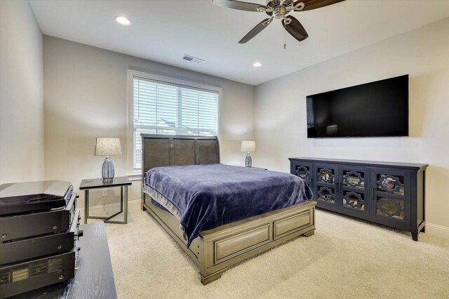 bedroom featuring ceiling fan and light colored carpet