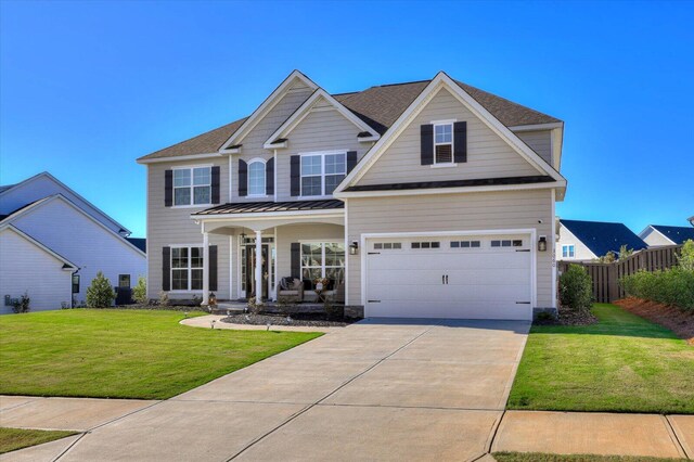 craftsman-style house with a garage and a front lawn