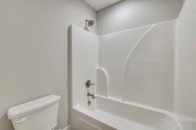 bathroom with shower / tub combination and toilet