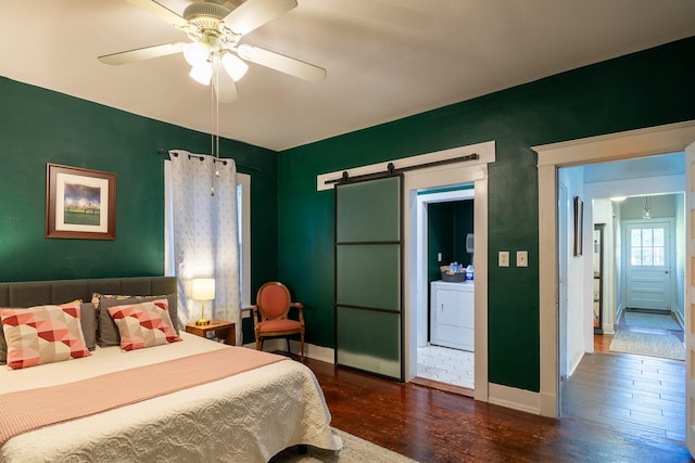 2005 Ohio Ave, Augusta, GA 30904 - bedroom featuring washer / clothes dryer, wood finished floors, a barn door, and ceiling fan
