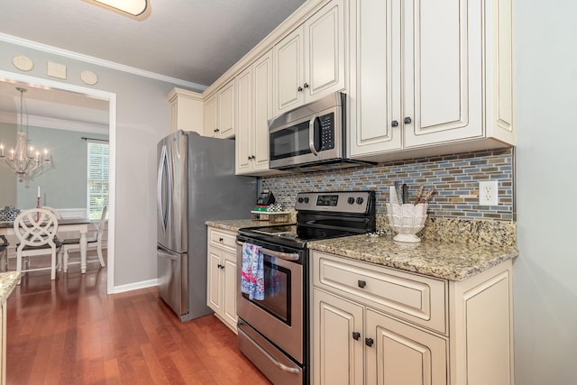 503 Pavilion Ct, Martinez, GA 30907 - kitchen with stainless steel appliances, decorative backsplash, a chandelier, wood finished floors, and ornamental molding