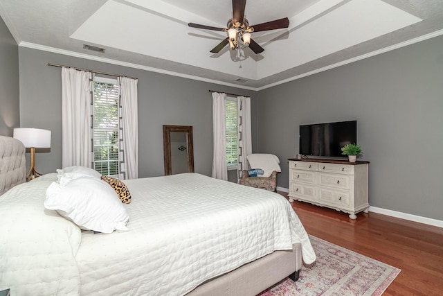 503 Pavilion Ct, Martinez, GA 30907 - bedroom featuring wood finished floors, a raised ceiling, crown molding, and a ceiling fan