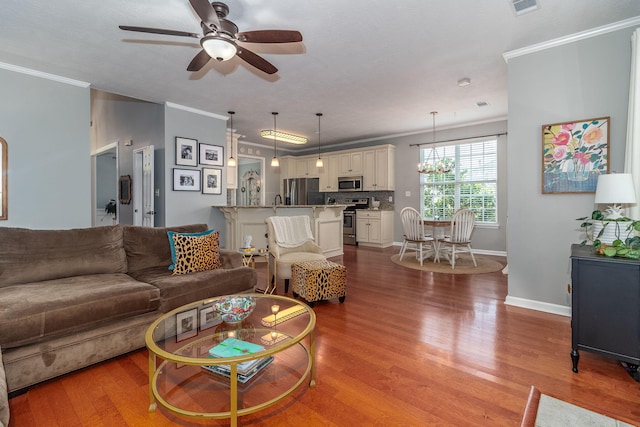 503 Pavilion Ct, Martinez, GA 30907 - living room with crown molding, wood finished floors, ceiling fan, and a chandelier