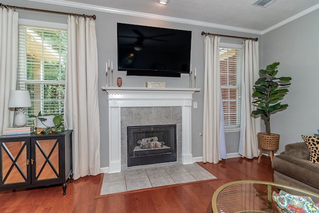 503 Pavilion Ct, Martinez, GA 30907 - living area with wood finished floors, crown molding, healthy amount of natural light, and a tile fireplace