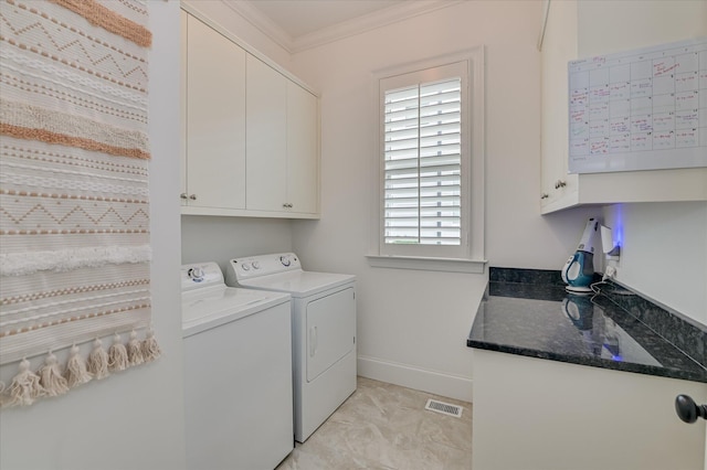 2084 Egret Cir, Evans, GA 30809 - laundry room with cabinet space, separate washer and dryer, crown molding, and baseboards