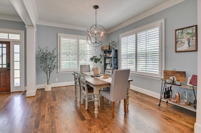 2084 Egret Cir, Evans, GA 30809 - dining area with a chandelier, ornamental molding, wood finished floors, and baseboards