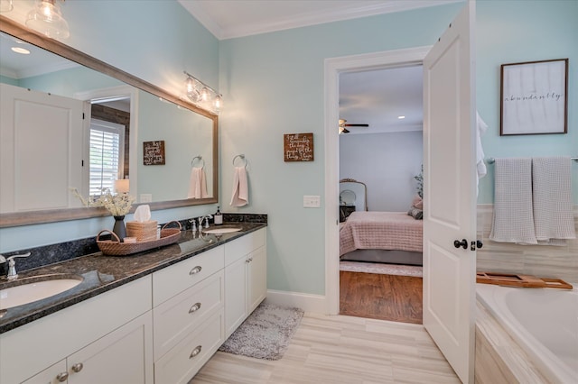 2084 Egret Cir, Evans, GA 30809 - ensuite bathroom with ornamental molding, double vanity, a tub, ceiling fan, and recessed lighting