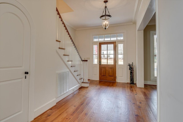 721 Bishops Cir, Evans, GA 30809 - entryway featuring crown molding and light hardwood / wood-style flooring