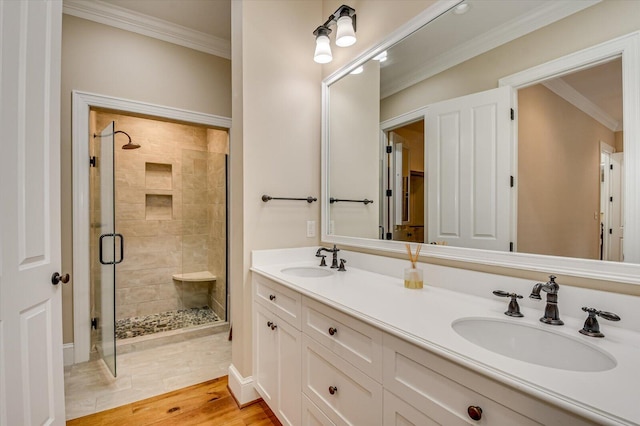 721 Bishops Cir, Evans, GA 30809 - bathroom featuring crown molding, wood-type flooring, an enclosed shower, and vanity