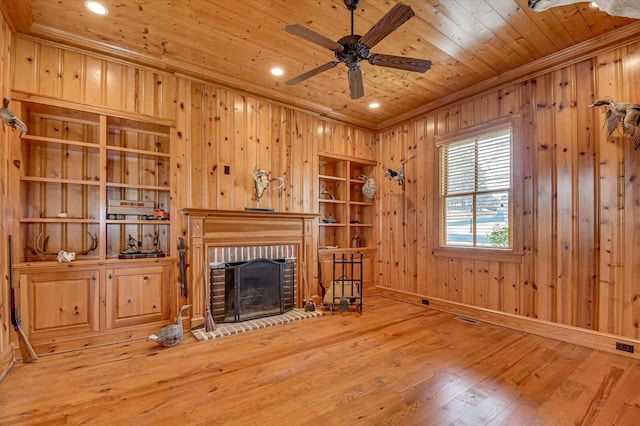 721 Bishops Cir, Evans, GA 30809 - unfurnished living room with a brick fireplace, wood-type flooring, wooden ceiling, and wood walls