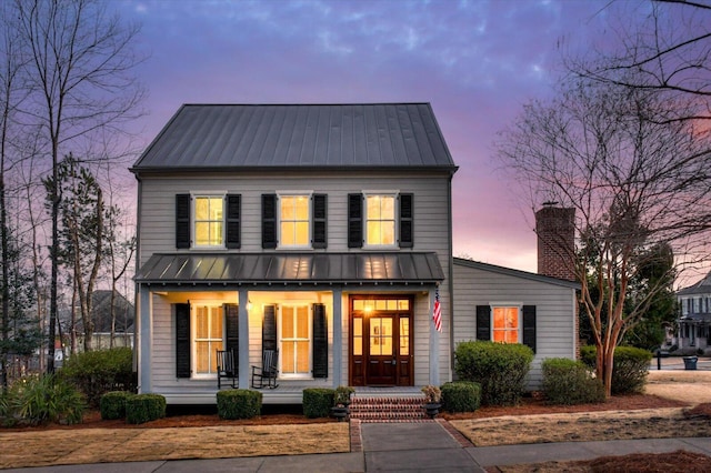 view of front of property featuring covered porch