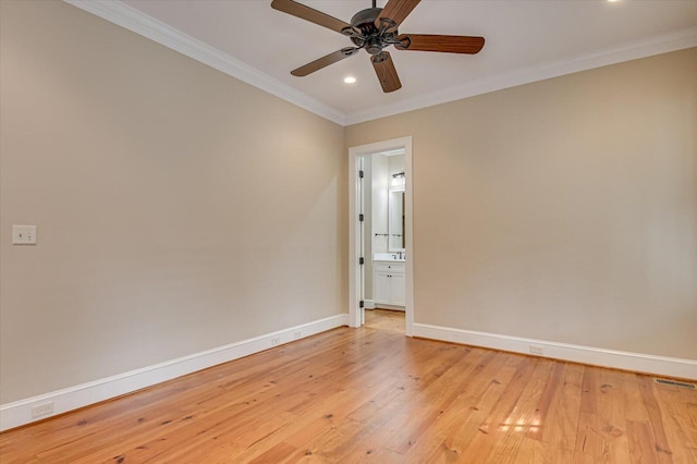 721 Bishops Cir, Evans, GA 30809 - spare room featuring ceiling fan, ornamental molding, and light wood-type flooring