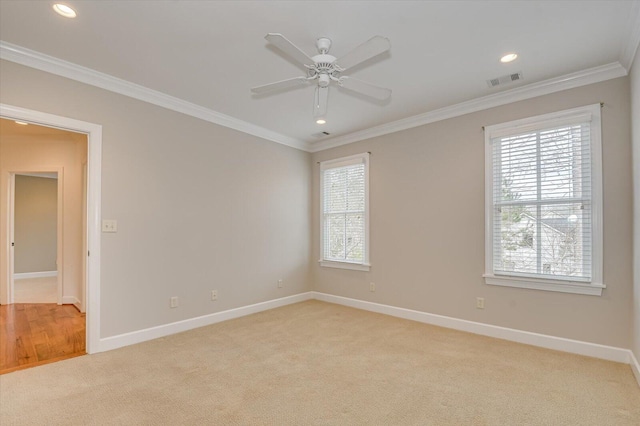 721 Bishops Cir, Evans, GA 30809 - spare room with crown molding, plenty of natural light, light colored carpet, and ceiling fan