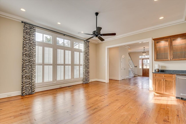721 Bishops Cir, Evans, GA 30809 - unfurnished living room with ornamental molding, ceiling fan, and light wood-type flooring