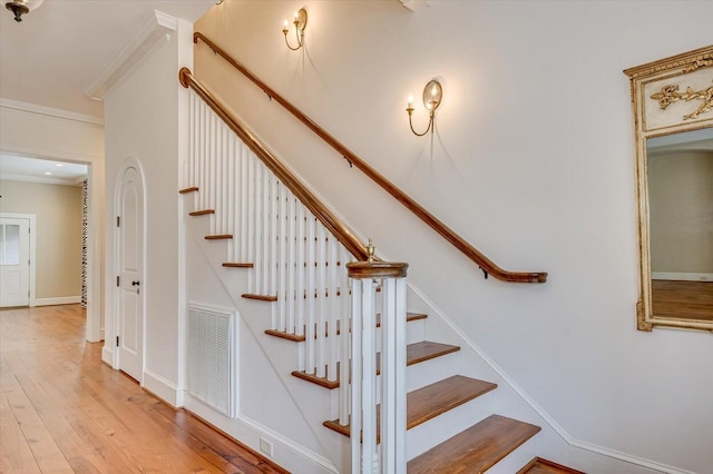 721 Bishops Cir, Evans, GA 30809 - staircase featuring hardwood / wood-style floors and ornamental molding