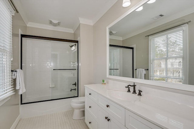 721 Bishops Cir, Evans, GA 30809 - full bathroom with tile patterned floors, toilet, crown molding, shower / bath combination with glass door, and vanity