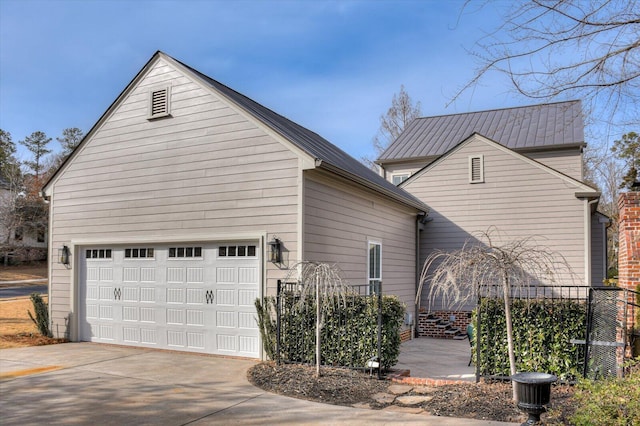 view of side of property with a garage