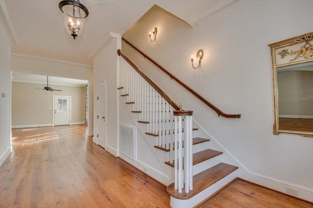 721 Bishops Cir, Evans, GA 30809 - stairs featuring hardwood / wood-style floors and ornamental molding