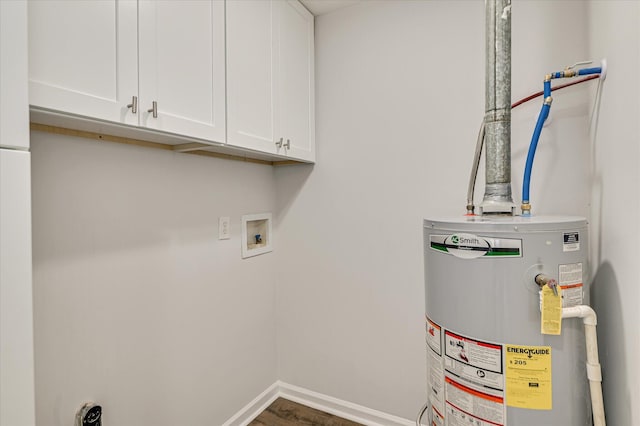 laundry room with cabinet space, hookup for a washing machine, gas water heater, wood finished floors, and hookup for an electric dryer