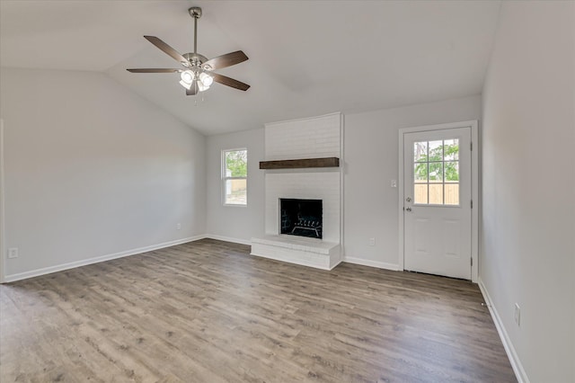 unfurnished living room featuring ceiling fan, plenty of natural light, and wood finished floors