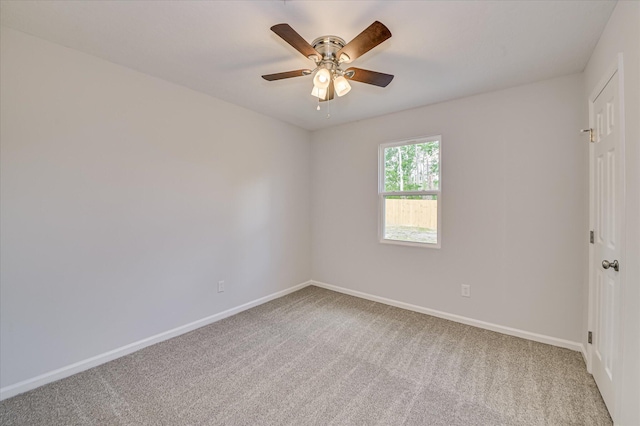 unfurnished room with carpet floors, baseboards, and ceiling fan