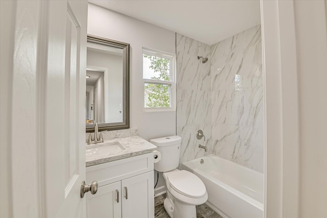 bathroom with toilet, washtub / shower combination, and vanity