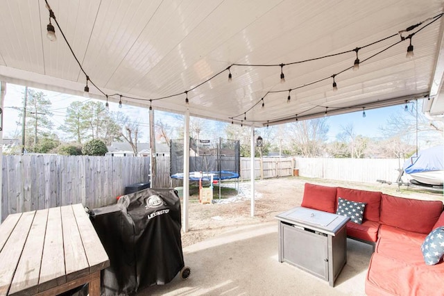 view of patio / terrace featuring grilling area and a trampoline