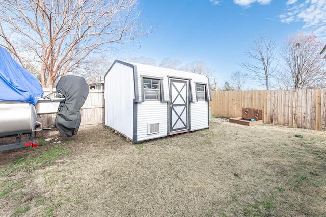 view of outdoor structure featuring a lawn