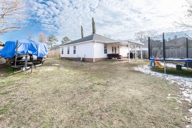 exterior space with a trampoline and central AC