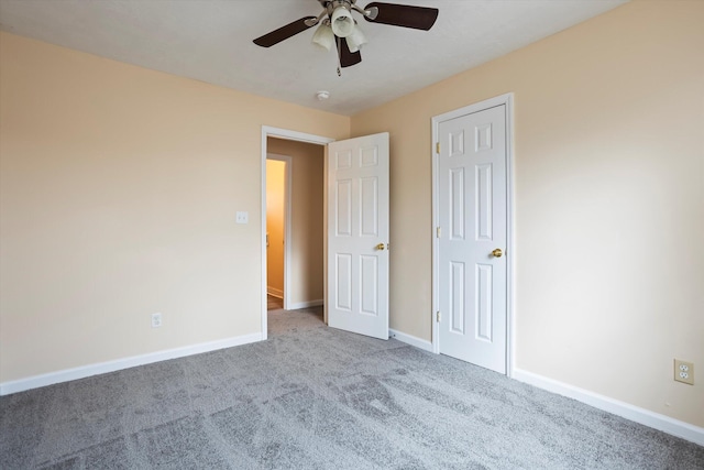 unfurnished bedroom with ceiling fan and light carpet