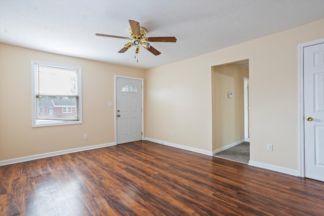 foyer entrance with dark wood-type flooring and ceiling fan