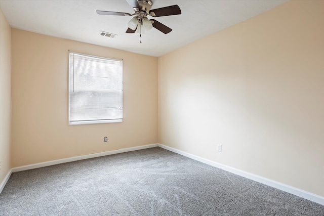 empty room featuring carpet floors and ceiling fan