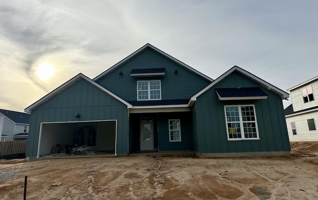 view of front of property featuring an attached garage and board and batten siding