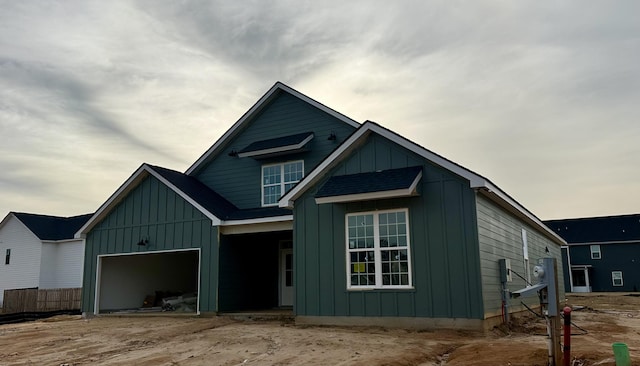 view of front of house with board and batten siding and an attached garage