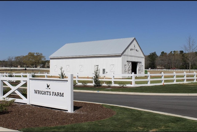 community sign featuring fence