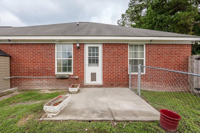 1737 Tamarind Way, Augusta, GA 30906 - rear view of property featuring a patio area, brick siding, and a shingled roof
