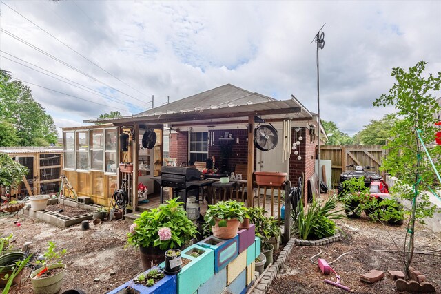1737 Tamarind Way, Augusta, GA 30906 - view of front of property with a greenhouse, an outbuilding, brick siding, and roof with shingles