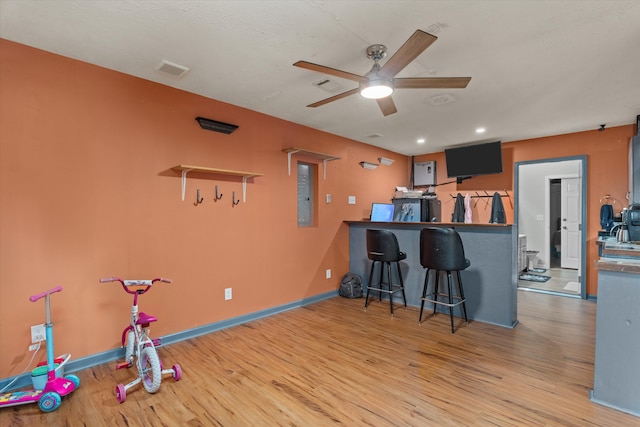1737 Tamarind Way, Augusta, GA 30906 - kitchen with wood finished floors, ceiling fan, electric panel, recessed lighting, and a kitchen bar