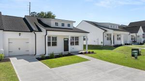 3269 Nolana Loop, Graniteville, SC 29829 - bungalow-style home with concrete driveway, a garage, and a front yard
